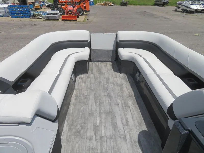 Slide: The Image of 2024 Crest Caribbean RS 250 SLS pontoon boat interior with spacious seating. - 3