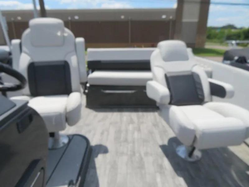 Slide: The Image of 2024 Crest Caribbean RS 250 SLS boat interior with plush seating and modern design. - 4