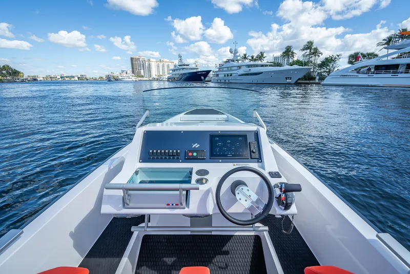 Slide: The Image of 2021 Goldfish 23 Tender boat dashboard with marina view. - 16