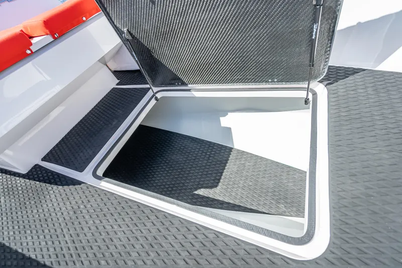 Slide: The Image of Open storage compartment on a 2021 Goldfish 23 Tender boat. - 28