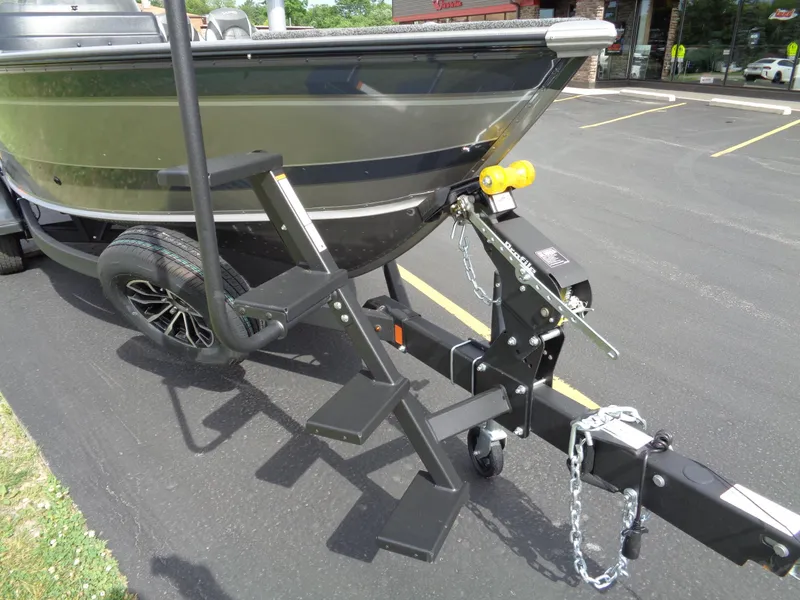 Slide: The Image of 2024 Lund 1875 Impact XS SS boat on trailer with attached steps. - 7