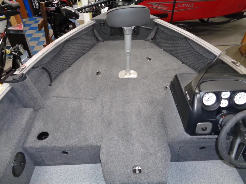 Slide: The Image of 2024 Lund 1875 Impact XS SS boat dashboard with Humminbird fish finder and gauges. - 15