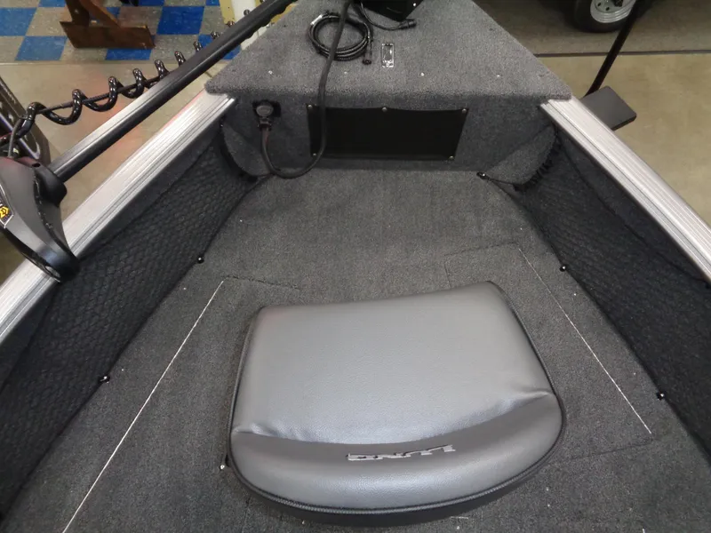 Slide: The Image of 2024 Lund 1875 Impact XS SS storage compartment with packaged equipment. - 19