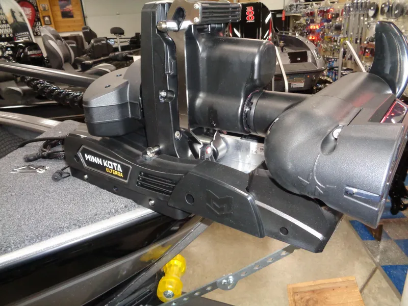 Slide: The Image of 2024 Lund 1875 Impact XS SS boat interior with seating and storage compartments. - 23