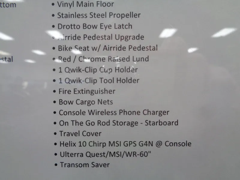 Slide: The Image of 2024 Lund 1875 Impact XS SS boat with Minn Kota Ulterra trolling motor. - 24