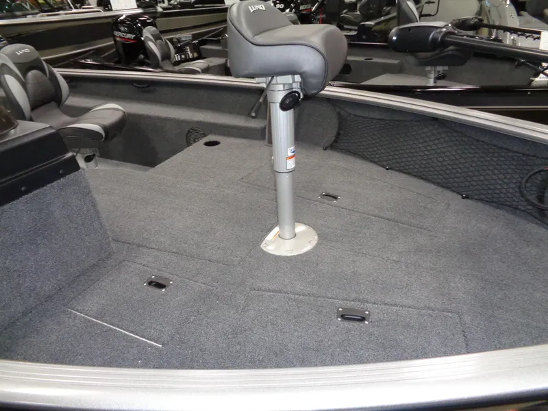 Slide: The Image of 2024 Lund 1875 Impact XS SS fishing boat with Mercury Pro XS 150 engine in showroom. - 4