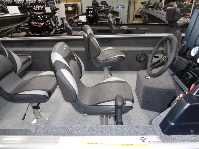 Slide: The Image of 2024 Lund 1875 Impact XS SS boat on trailer, side view. - 6