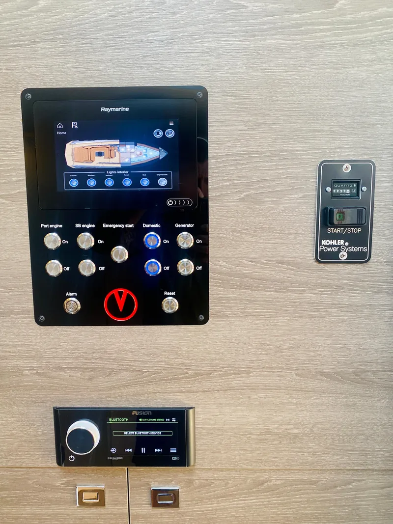 Slide: The Image of Control panel of a 2020 Vanquish VQ45 yacht with navigation and system controls. - 32