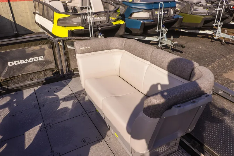 Slide: The Image of 2024 Sea-Doo Switch 16 pontoon boat with comfortable seating and modern design. - 9