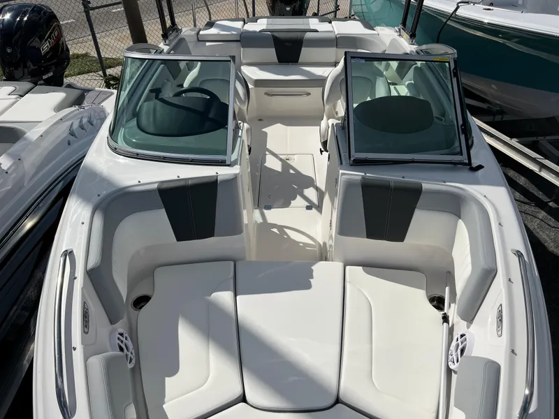 Slide: The Image of 2023 Chaparral 23 SSi OB boat with white and gray interior, open bow seating. - 11