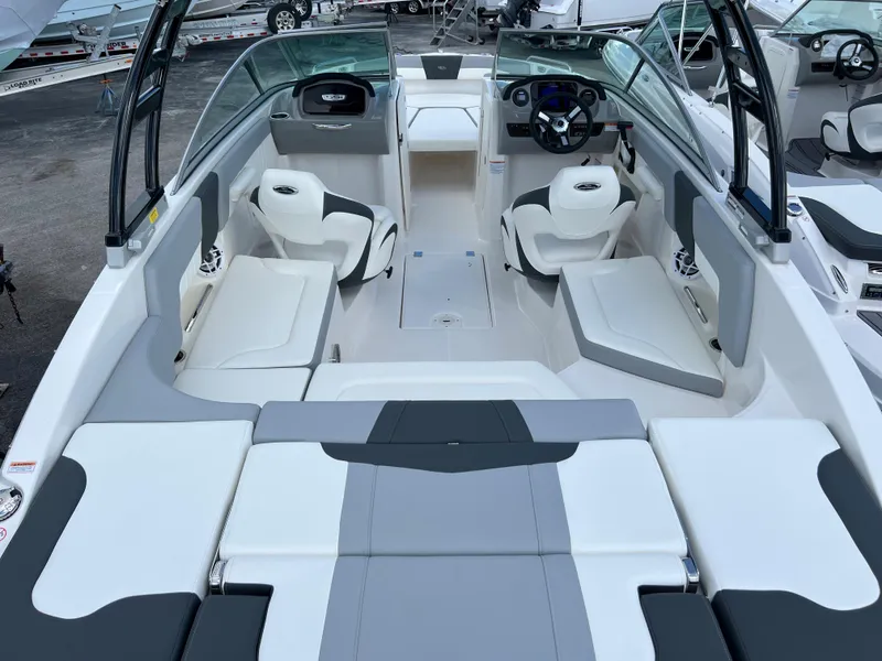 Slide: The Image of 2023 Chaparral 23 SSi OB boat interior with white and gray seating. - 5