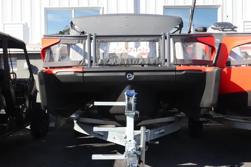 The Image of 2024 Sea-Doo Switch Sport 21 on trailer, featuring vibrant red and black design. - 0