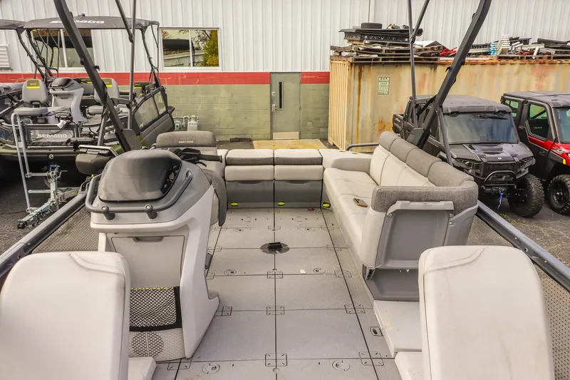 Slide: The Image of 2024 Sea-Doo Switch Sport 21 pontoon boat interior with spacious seating and modern design. - 13