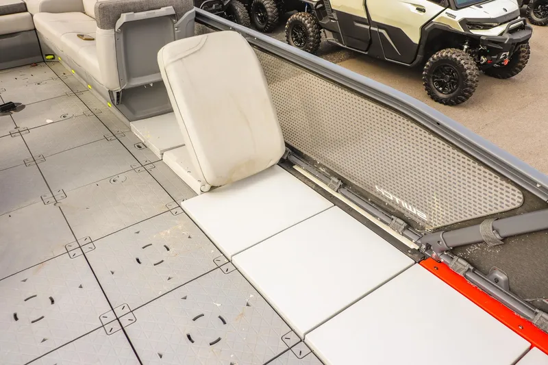 Slide: The Image of 2024 Sea-Doo Switch Sport 21 interior with modular seating and textured flooring. - 14