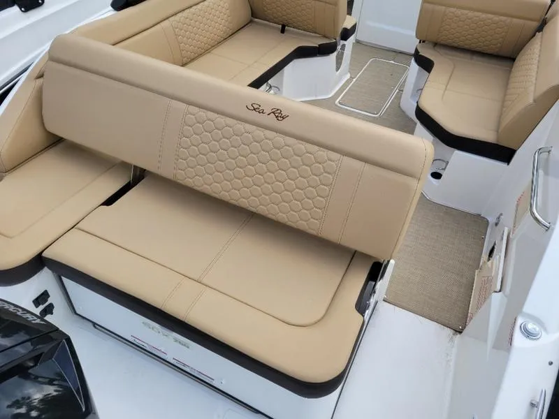 Slide: The Image of 2024 Sea Ray SDX 250 Outboard boat interior with tan leather seating. - 13