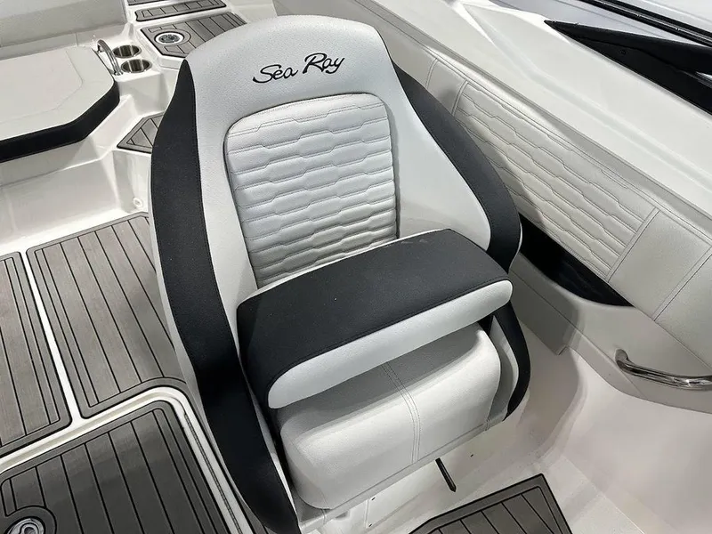 Slide: The Image of 2024 Sea Ray 210 SPX OB captain's chair with premium upholstery. - 6