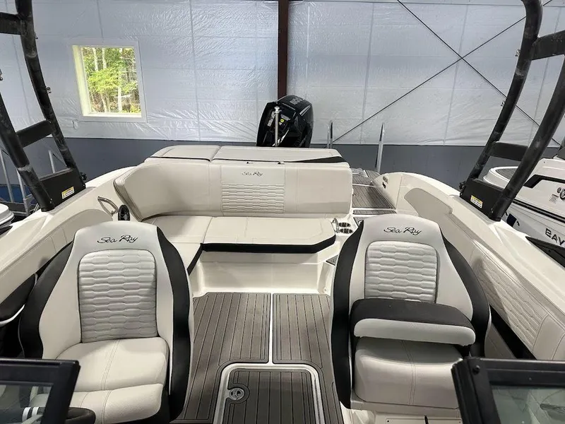 Slide: The Image of 2024 Sea Ray 210 SPX OB boat interior with white and black seating. - 7