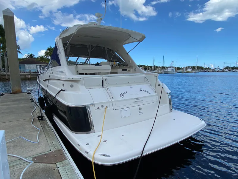 Slide: The Image of 2004 Regal 3860 Commodore yacht docked at marina. - 12