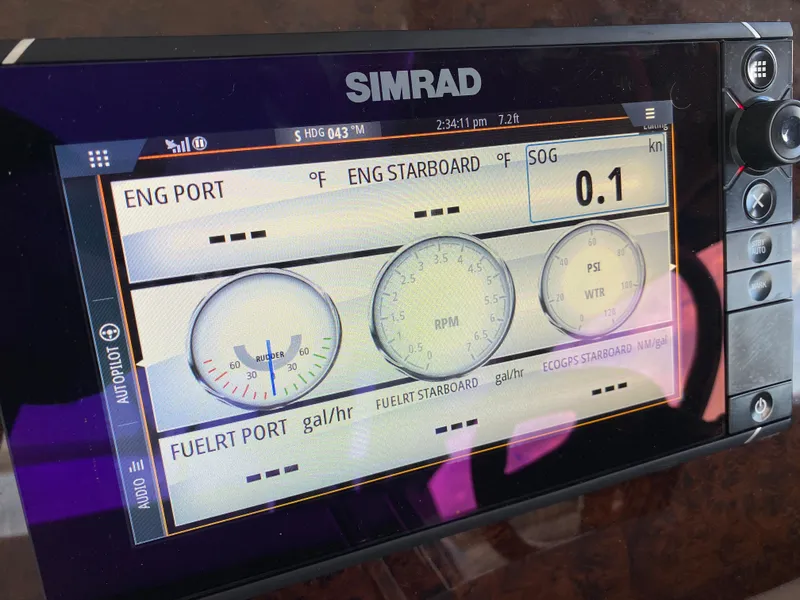 Slide: The Image of Simrad display on 2004 Regal 3860 Commodore showing engine and fuel data. - 18