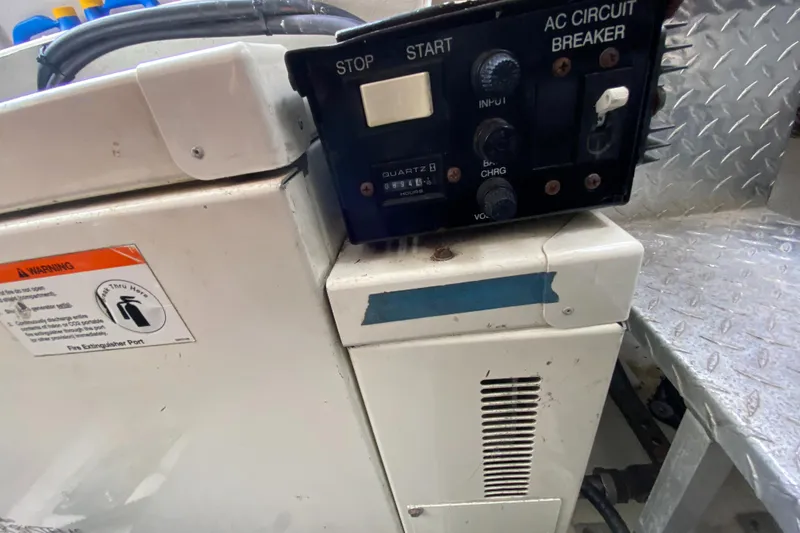 Slide: The Image of 2004 Regal 3860 Commodore boat control panel and AC circuit breaker. - 26