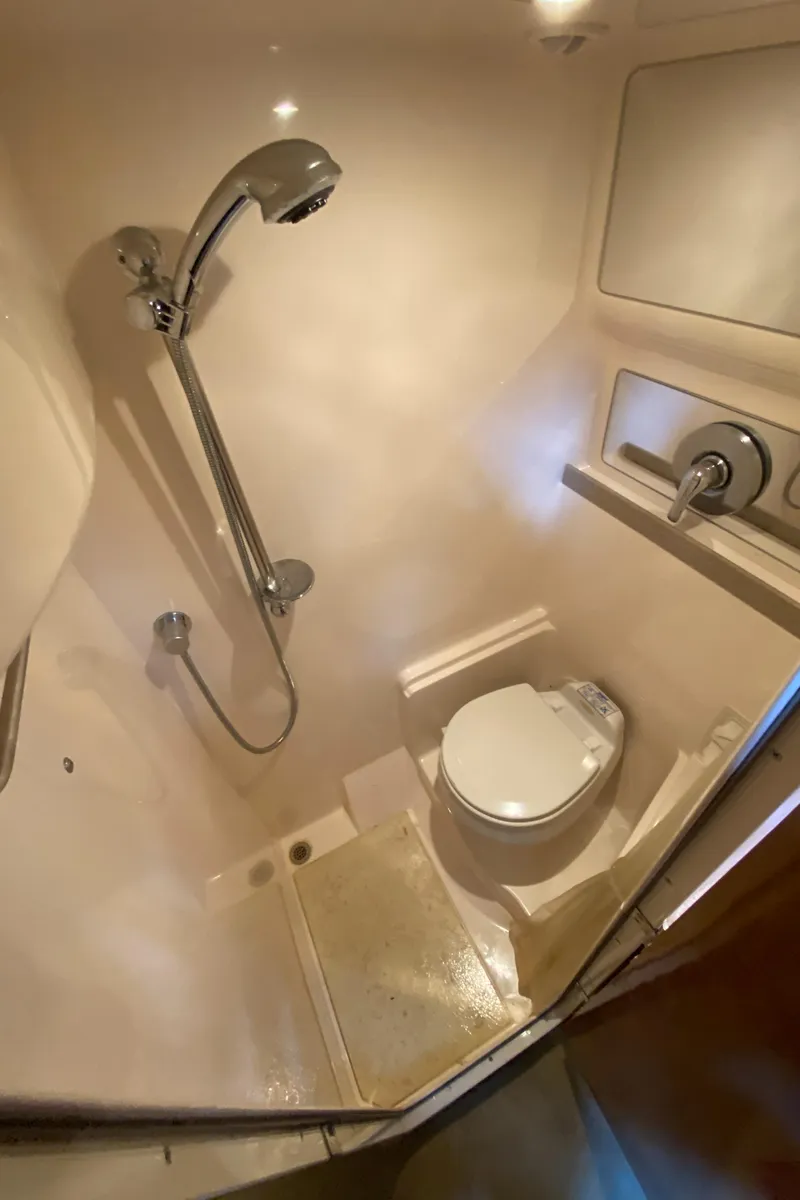 Slide: The Image of Compact bathroom in 2004 Regal 3860 Commodore yacht with shower and toilet. - 29