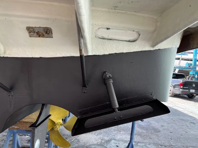 Slide: The Image of Close-up of the stern and propeller of a 2004 Regal 3860 Commodore boat. - 33