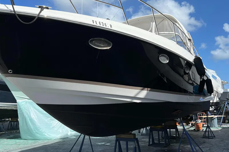 Slide: The Image of 2004 Regal 3860 Commodore yacht on stands for maintenance. - 35