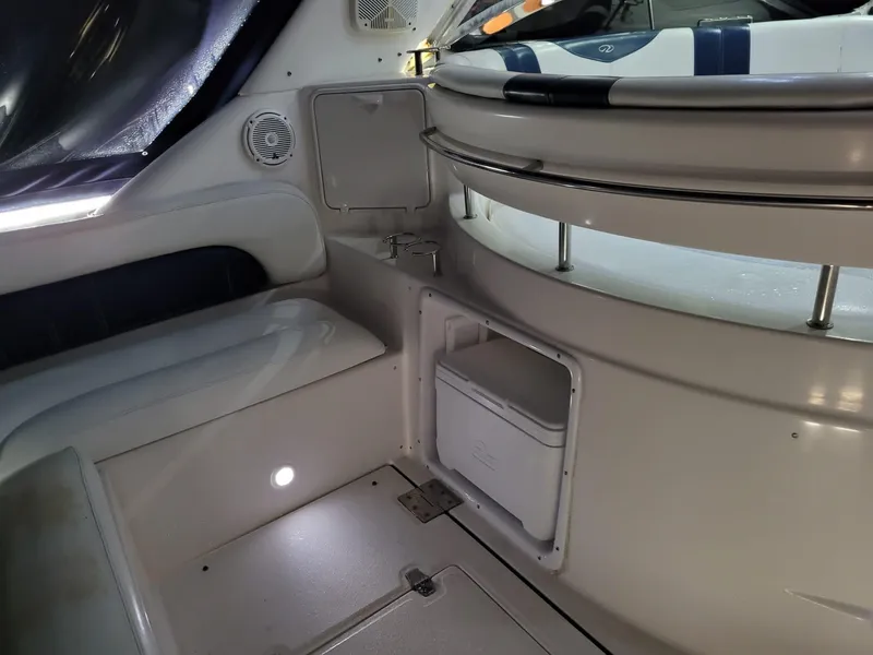 Slide: The Image of Interior of 2004 Regal 3860 Commodore yacht with seating and storage compartments. - 38