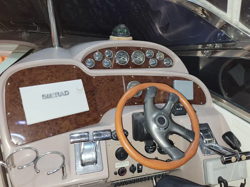 Slide: The Image of 2004 Regal 3860 Commodore boat helm with Simrad and Garmin navigation systems. - 39