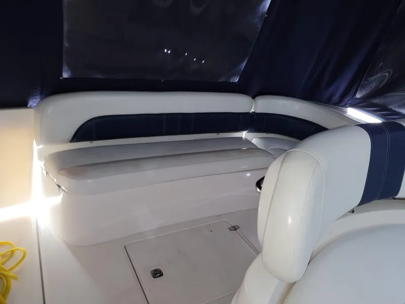 Slide: The Image of 2004 Regal 3860 Commodore boat interior with white and blue seating. - 41