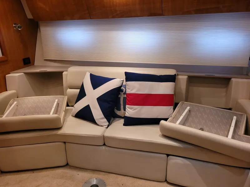 Slide: The Image of Interior of 2004 Regal 3860 Commodore with nautical-themed pillows on a beige sofa. - 45