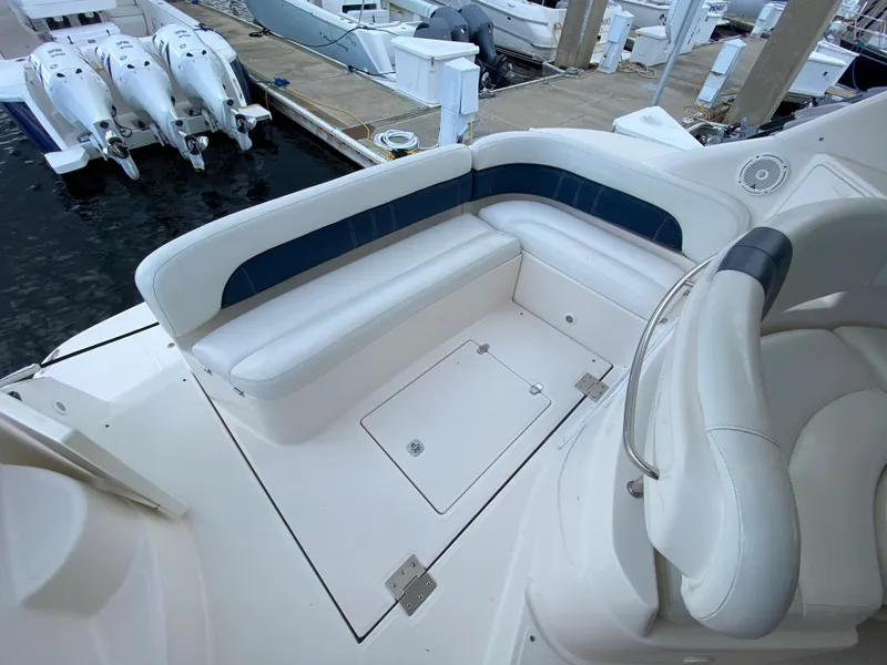 Slide: The Image of 2004 Regal 3860 Commodore boat seating area at dock. - 6