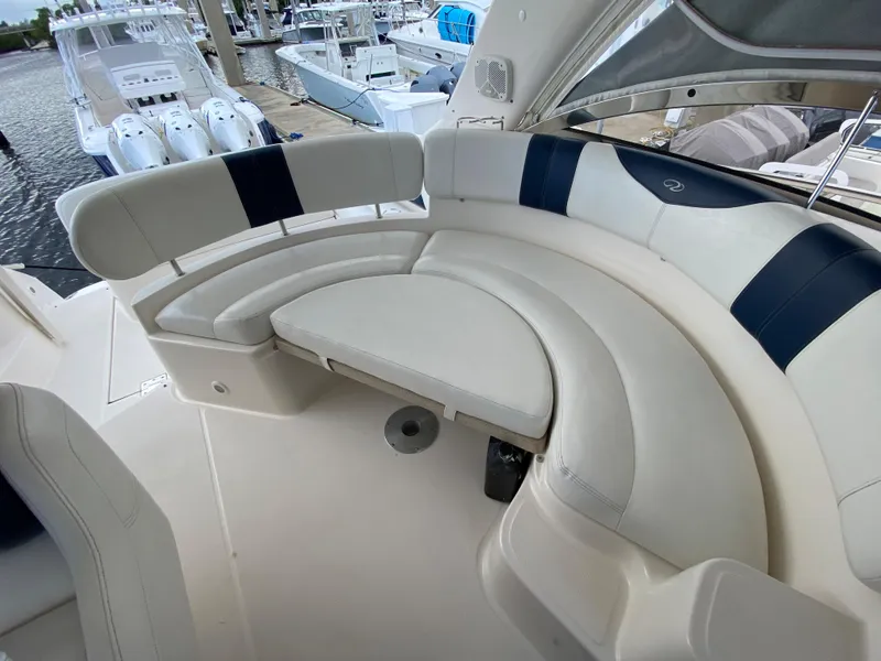 Slide: The Image of 2004 Regal 3860 Commodore yacht interior seating area. - 7