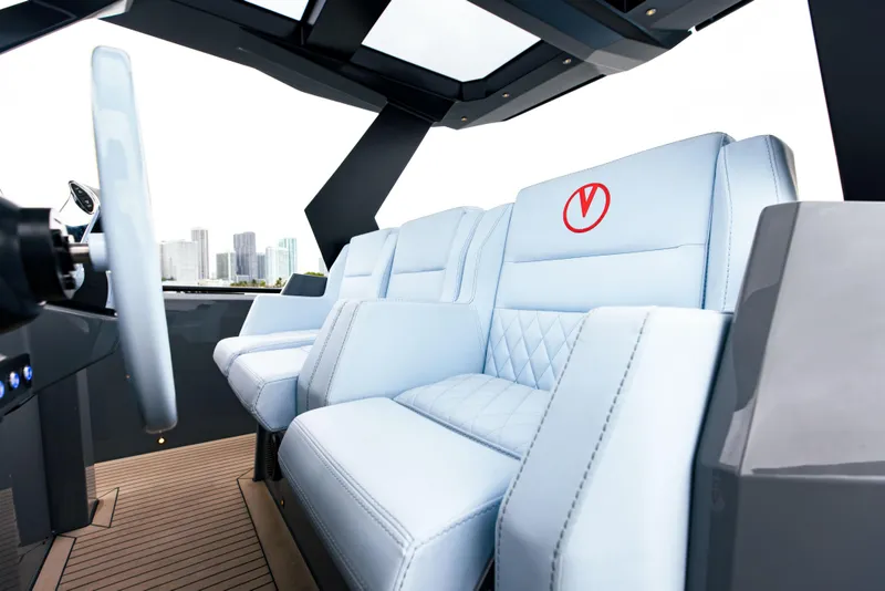Slide: The Image of 2022 Vanquish Yachts VQ40 interior with luxurious white seating and modern design. - 16