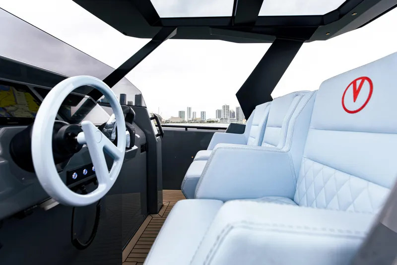 Slide: The Image of Interior of 2022 Vanquish Yachts VQ40 with white leather seats and modern steering wheel. - 17