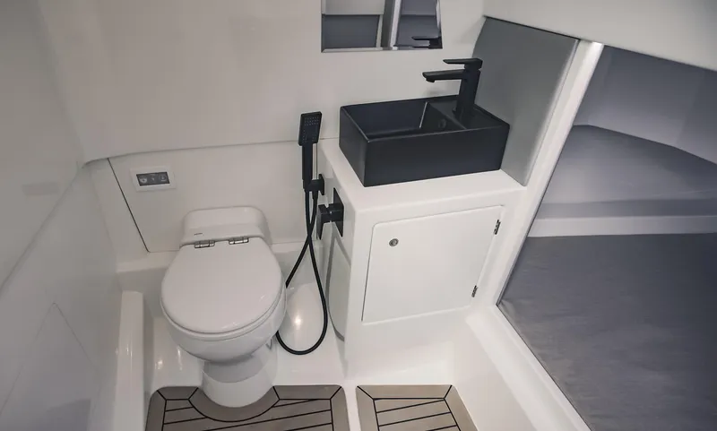 Slide: The Image of Modern bathroom in 2022 Vanquish Yachts VQ40 with sleek fixtures and compact design. - 21
