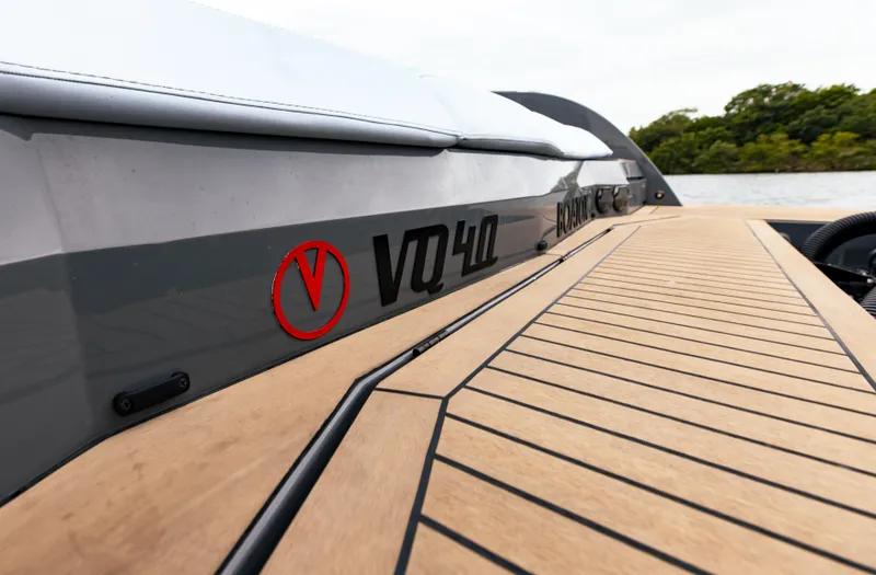 Slide: The Image of 2022 Vanquish Yachts VQ40 with sleek design and wooden deck. - 10