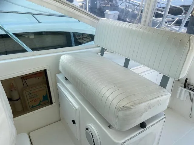 Slide: The Image of Cabo 35 Express 2000 model boat interior with storage compartments and seating area. - 11