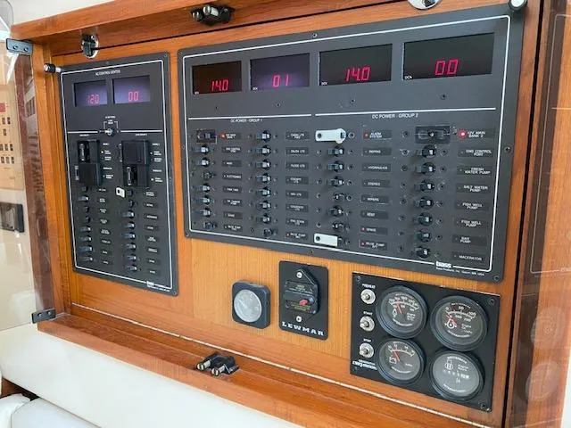 Slide: The Image of Compact bathroom in a 2000 Cabo 35 Express boat with sink and toilet. - 16