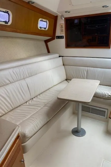Slide: The Image of 2000 Cabo 35 Express yacht kitchen with open fridge and wooden cabinets. - 31