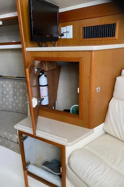 Slide: The Image of Interior of 2000 Cabo 35 Express yacht with stairs leading to deck. - 32