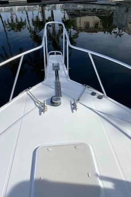 Slide: The Image of 2000 Cabo 35 Express boat with gold rod holders. - 37