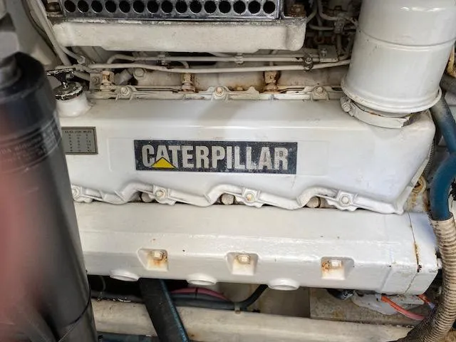 Slide: The Image of Westerbeke generator in the engine room of a 2000 Cabo 35 Express boat. - 46