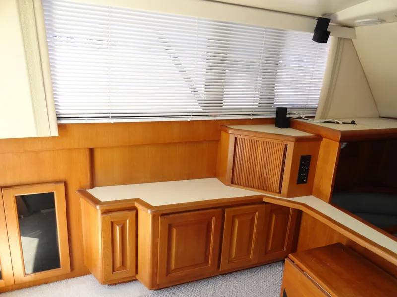 Slide: The Image of Interior of 1989 Viking 41 Sportfish Convertible with wooden cabinetry. - 11