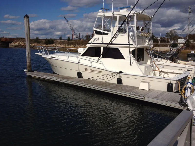 Slide: The Image of 1989 Viking 41 Sportfish Convertible docked at marina. - 2