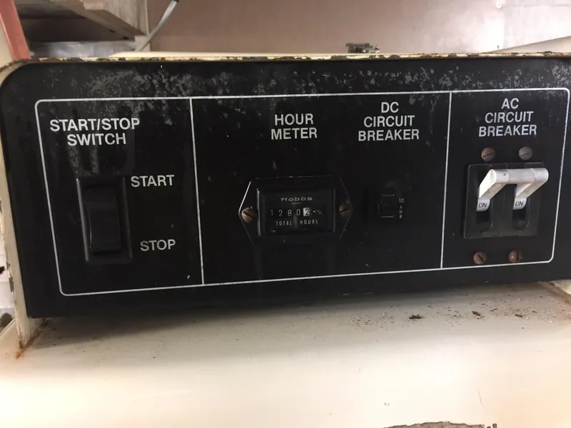 Slide: The Image of Control panel of a 1989 Viking 41 Sportfish Convertible boat. - 27