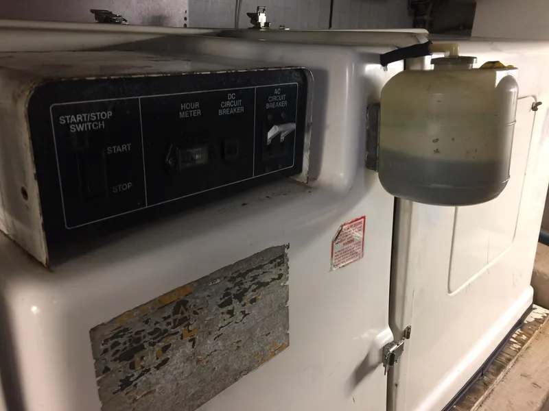 Slide: The Image of Generator control panel on a 1989 Viking 41 Sportfish Convertible boat. - 28