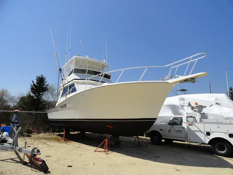 Slide: The Image of 1989 Viking 41 Sportfish Convertible on a dry dock. - 3