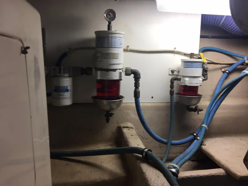 Slide: The Image of Engine room of 1989 Viking 41 Sportfish Convertible with fuel filters. - 33