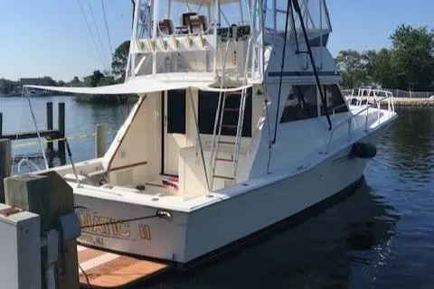 Slide: The Image of 1989 Viking 41 Sportfish Convertible docked at marina. - 41